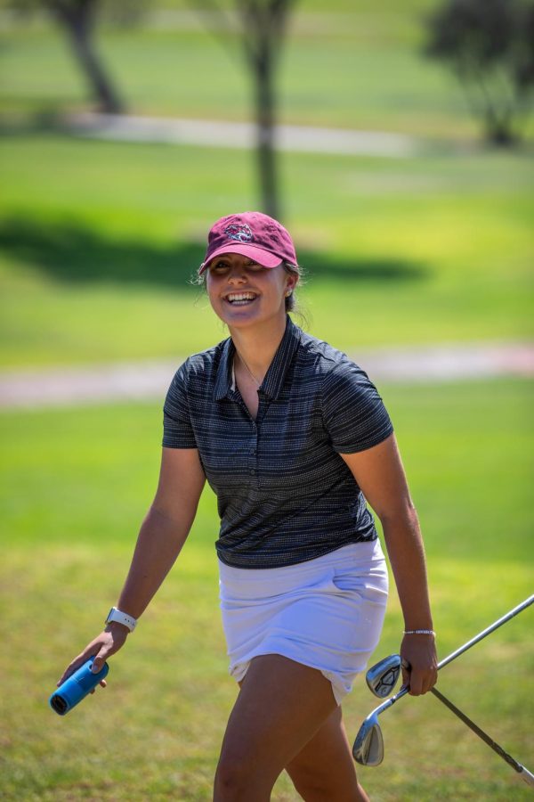 Walking towards her golf shot, junior Taylor Stewart looks to be in good spirits. Photo captured by Chico State Sports Information.