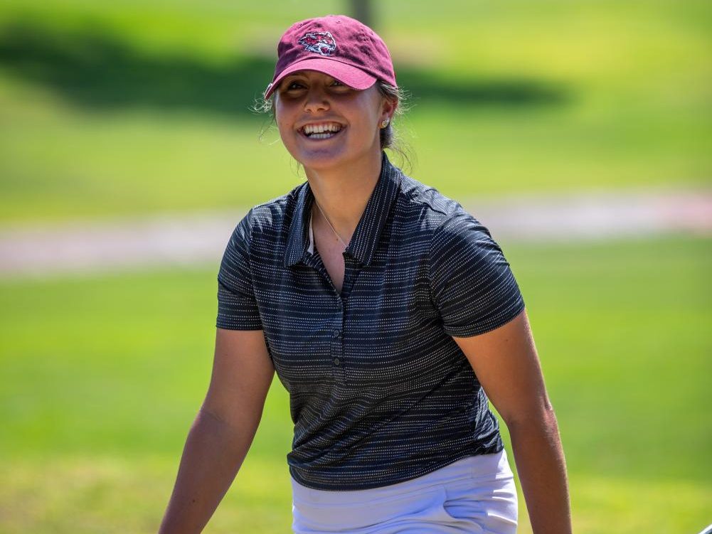 Walking towards her golf shot, junior Taylor Stewart looks to be in good spirits. Photo captured by Chico State Sports Information.