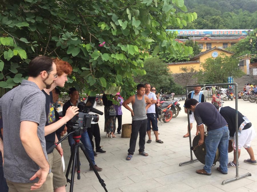 Cinematographer/Editor,Tanner Hansen(Red Hair) with Dr. Nitzky (Brownish Hair) filming in Lihu township, Nandan County, Guangxi, China. Photo provided to William Nitzky, PhD.