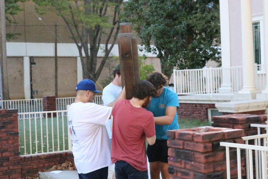 Moving the giant menorah out of where the Sukkah is being made. Features Seth Tractman, Jasper Liebert, Kyle Simmons and Noah Burman. Taken on Sept. 27 by Maki Chapman