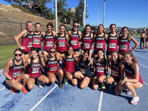 Chico State Womens Cross Country team huddles together to celebrate coming second in race. Photo by Gary Towne.