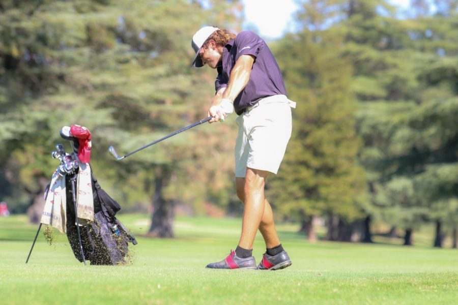 On Oct. 11, sophomore Mark Noonan looks to aim his shot onto the green on the 18th hole at the Peach Tree Golf and Country Club in Marysville, California. Noonan finished tied for a fourth place going 9 under par during the two day tournament. Photo Credit: Alejandro Mejia Mejia