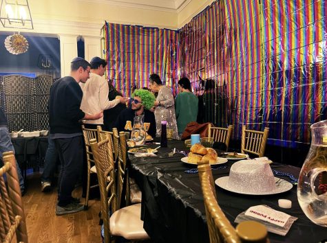 People gather at the Purim buffet as the feast begins. Taken by Ariana Powell, March 7.