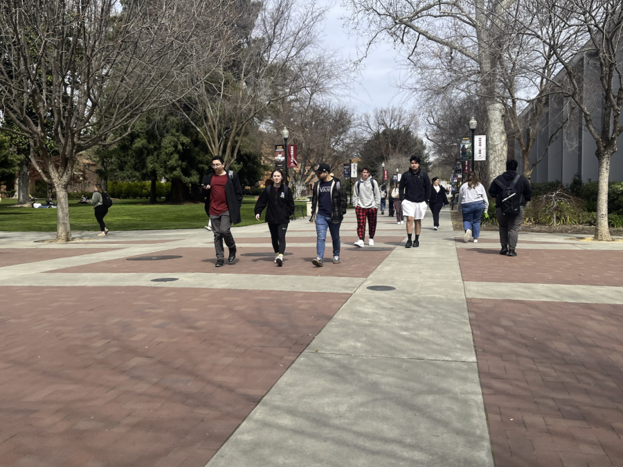 Students walk on Chico State campus near the Bell Memorial Union. Taken by Ariana Powell, March 27.