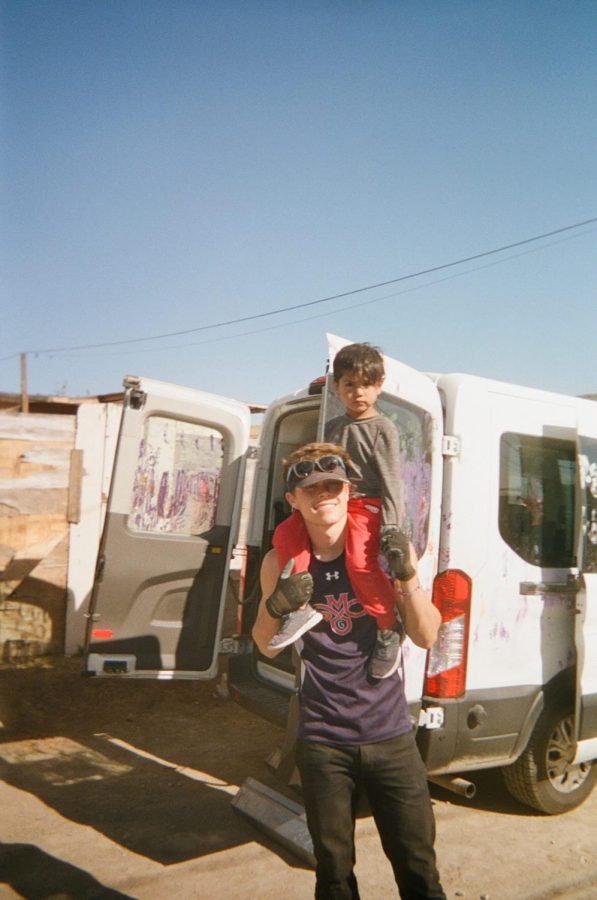 Jojo Murphy with local child of Tijuana Mexico as he was helping to build houses within the area. Photo submitted by Jojo Murphy.
