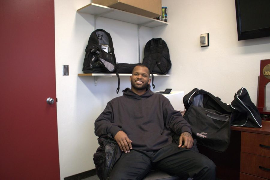 Joshua Hamilton relaxing in the basketball office. Photographed by Wyatt Alpert on March 9.