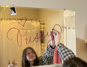 Leah McKechnie writing pussy on a mirror with lipstick