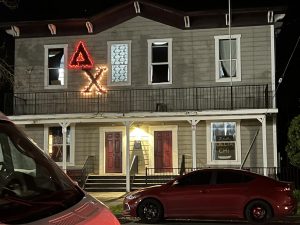The Delta Chi house April 10. Hours after having their chapter revoked the lights on their letters remain lit. Photo taken by Molly Myers.
