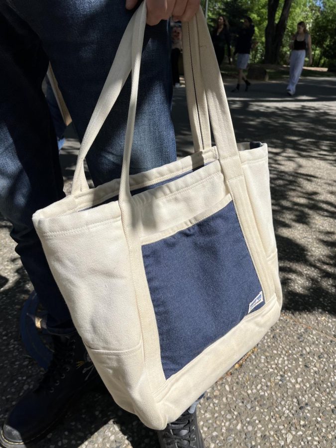 navy and cream colored tote