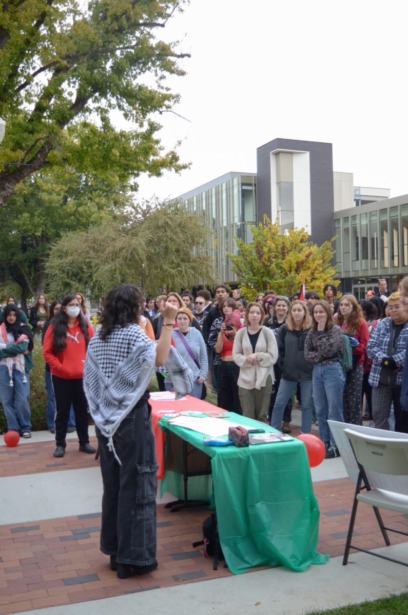 Students attending the walkout gather in front of Kendall Lawn to learn about Palestine.