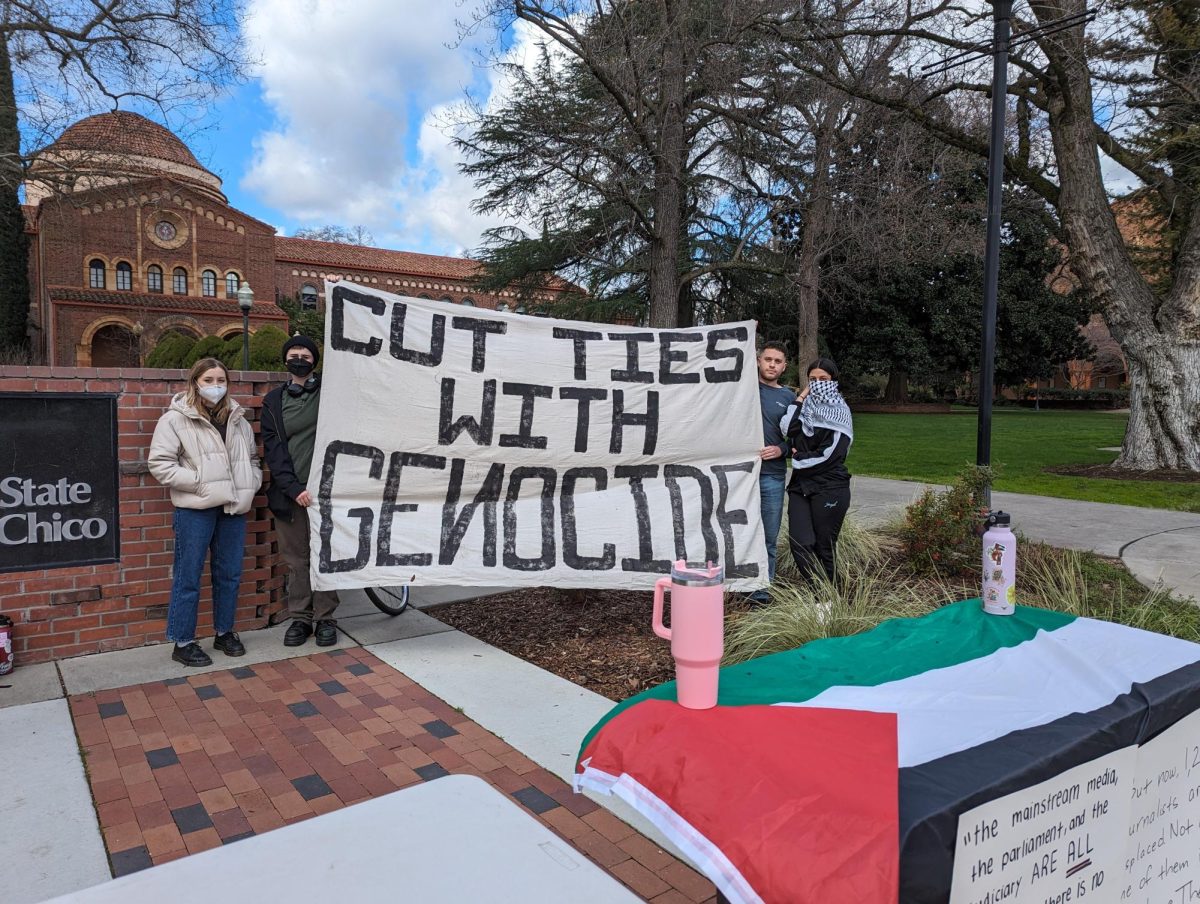 Members of SWANASA group holding up a cut ties with genocide banner on Chico States campis