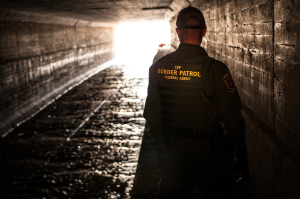 Border patrol agent inspects a water drainage tunnel that spans from Nogales, Arizona into Mexico. Courtesy: U.S Customs and Border Patrol,  Josh Denmark
