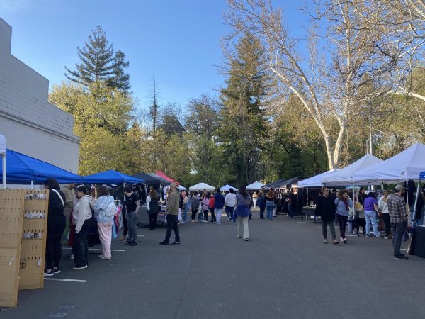 Different crowds of people buzzed with curiosity at the pop-ups that filled the parking lot. Taken by Itzel Saucedo on April 6, 2024. 
