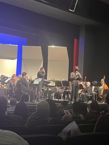 Student Isaac Potkin introducing his arrangement of Indiana Jones during the wind ensemble concert. Taken by Jessica Miller on April 27.