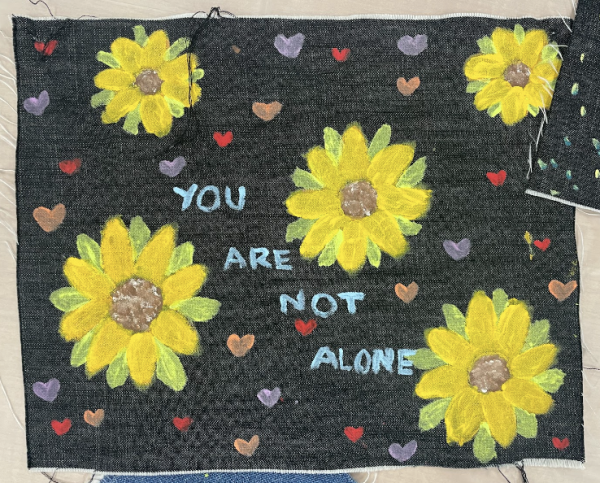 One of the many painted denim squares featured throughout the Denim Day Resource Fair and Museum. Taken by Nadia Hill on, April 24.