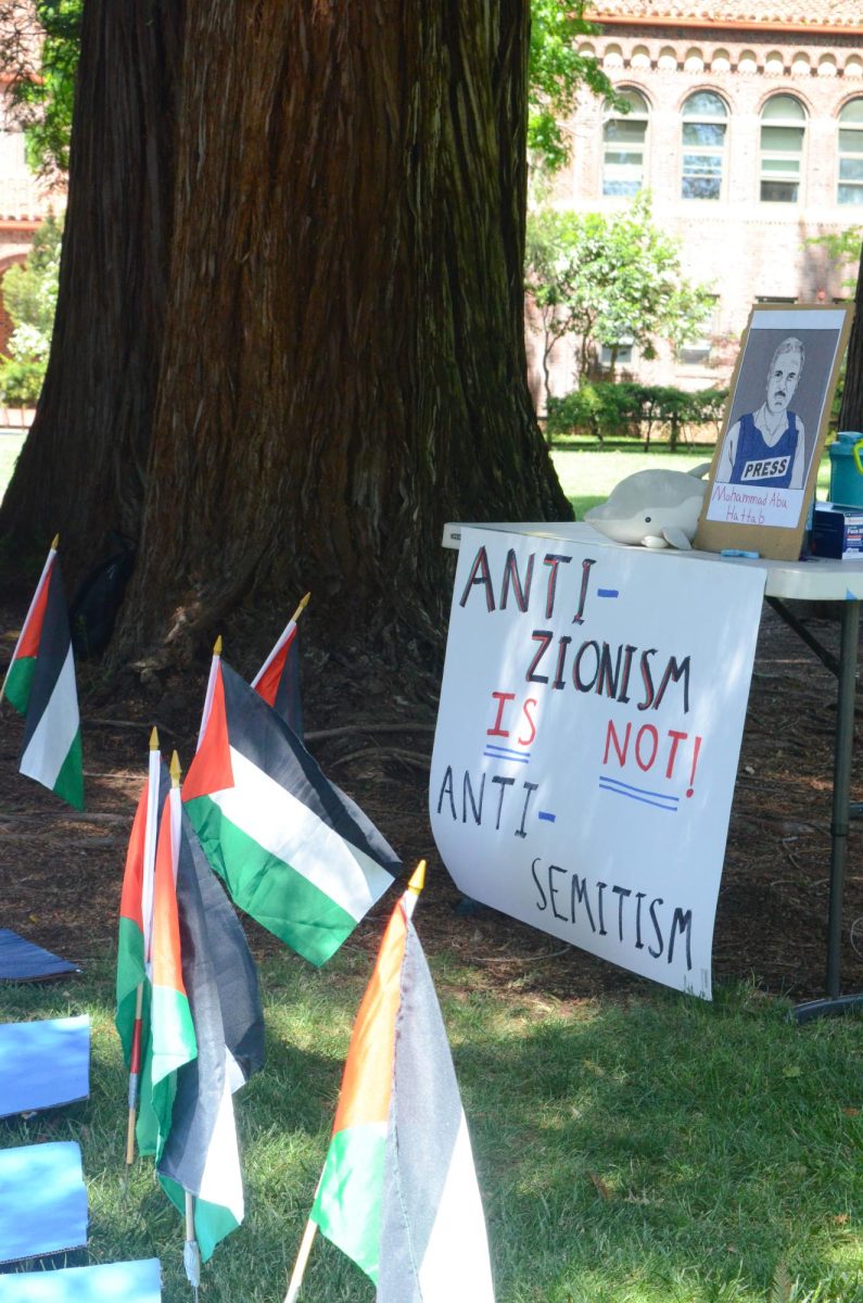 A table at the SJP walkout with a sign that read Anti-zionism is not! Anti-semitism.