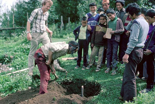 Dr. Lee Altier,far left, helping a Tibetan refugee community establish an apple orchard in Nepal during his time in the Peace Corps. Courtesy: Dr. Lee Altier, 1980s. 