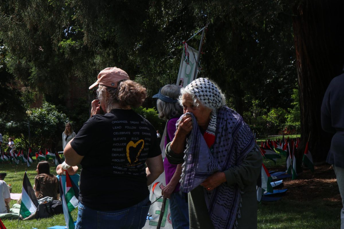 Emily Alma (right) attended the protest on Monday. Alma is Jewish and is in support of the Palestinian community.