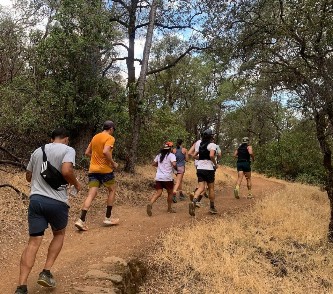 Seven Bidwell Run Club runners climb a hill at Bidwell Canyon Trail during one of their weekly meetings. Photo courtesy of Andrew D’Lugos. 