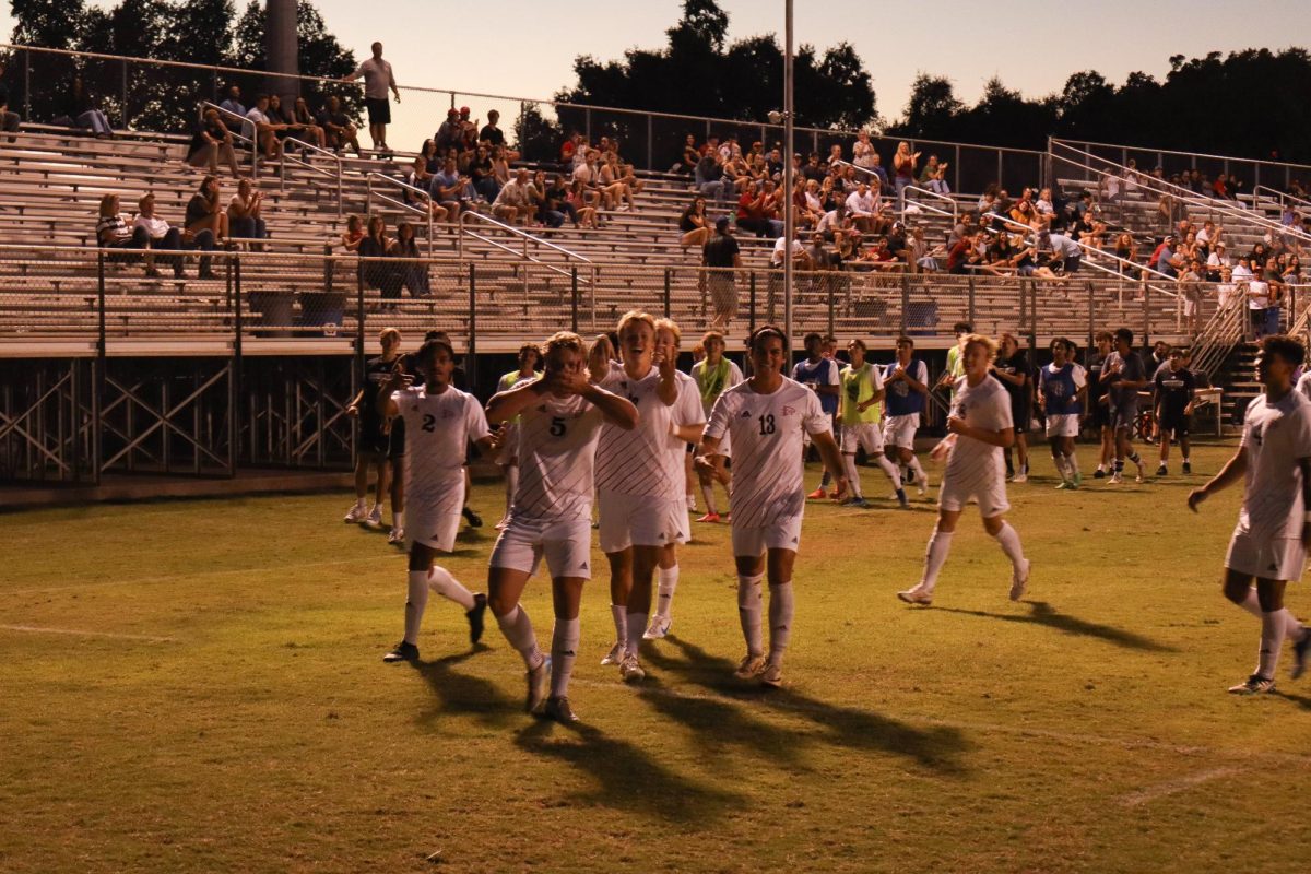 Chico State Wildcats’ #5 Miles Rice celebrates with his teammates after scoring a goal in the first half against Stanislaus State on Sept. 28 in Chico. Photo taken by Trevor Lee.
