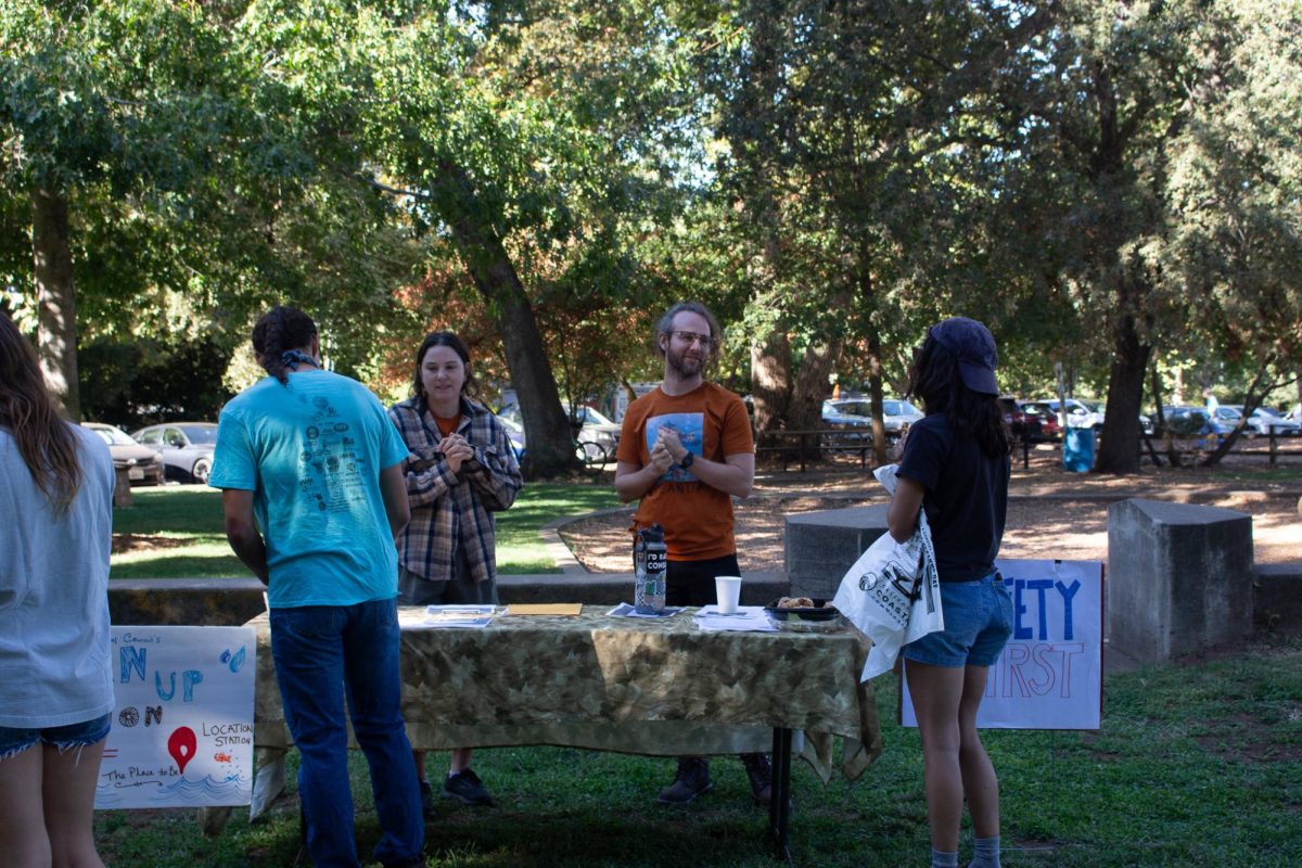 Volunteers Maddy Mikles (left) and Greg Shafer (right) help dispatch volunteers to different locations around the park on Sept. 21. Over 400 volunteers were dispersed around Bidwell Park and Chico Creeks.