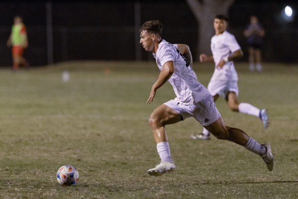 Senior defender Preston Moll moving the ball up the pitch in the second half of Thursday's match against the Simon Fraser Red Leafs. Photo taken by Aaron Draper on Sep. 12, 2024.