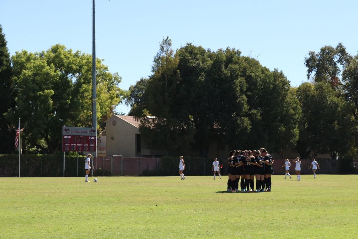 Chico State women’s soccer team huddling up before their game against Colorado School of Mines. Photo taken by Nate Paddock on Sept. 8.

