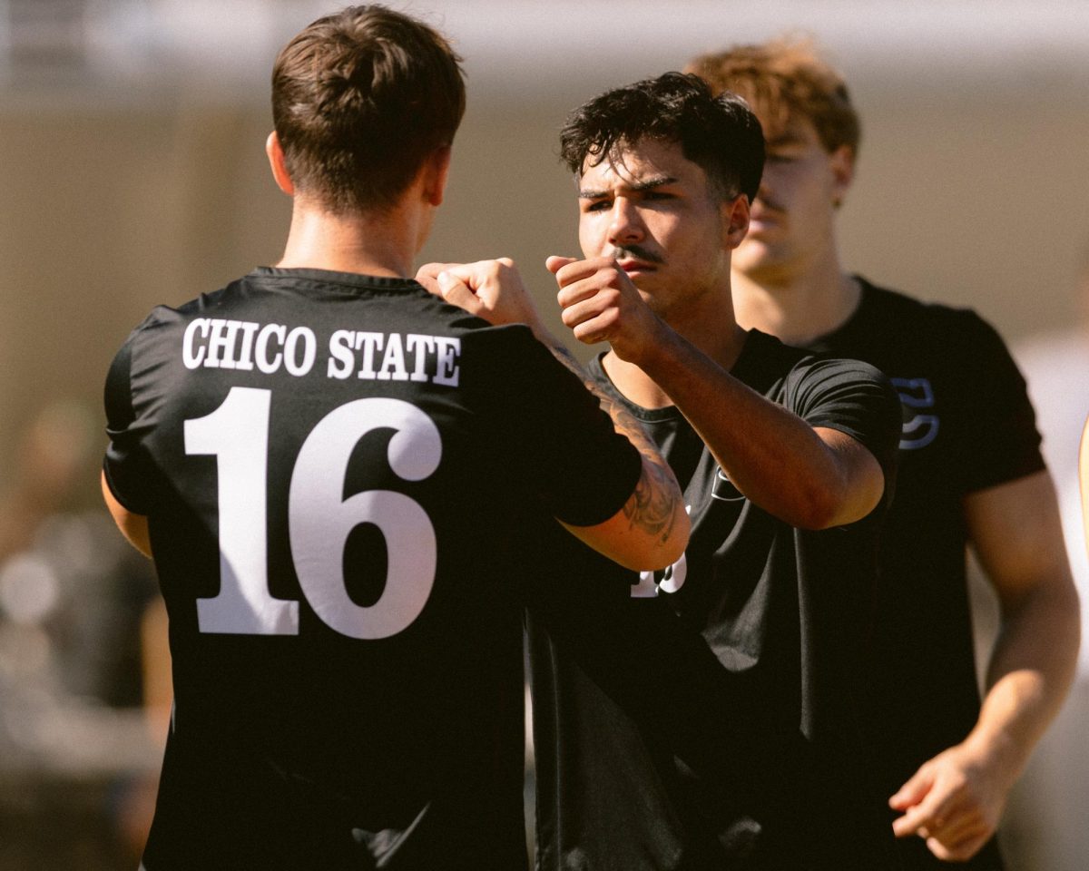 Chico State senior defender Preston Moll fist fist-bumping junior defender Carson Zarate pregame before taking on the Cal State Dominguez Hills Toros on Oct. 6. Photo taken by Aaron Draper.