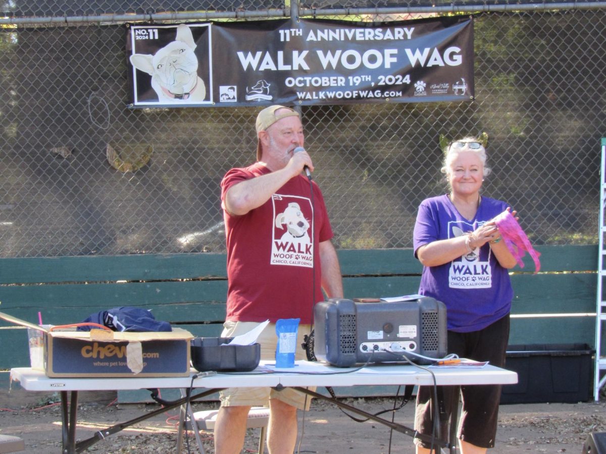 Eric and Shelly Rogers calling out raffle winners and thanking sponsors and volunteers at Walk Woof Wag on Saturday. The couple are long-term volunteers with both the shelter and the annual event. Photo taken by Megan Gauer on Oct. 19.
