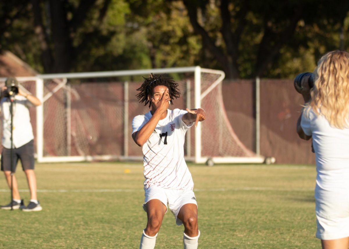 Sophomore midfielder Sylas Sells celebrates and poses for a picture after hitting a goal during the second half, tying the game 1-1 against Cal State LA Friday Oct. 4, 2024 at Chico State.