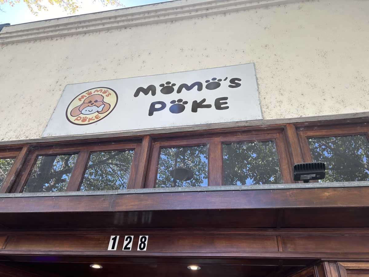 Sign above the entrance of Momo’s Poke. Taken by Dominic Curcuro on Sept. 19, 2024. 
