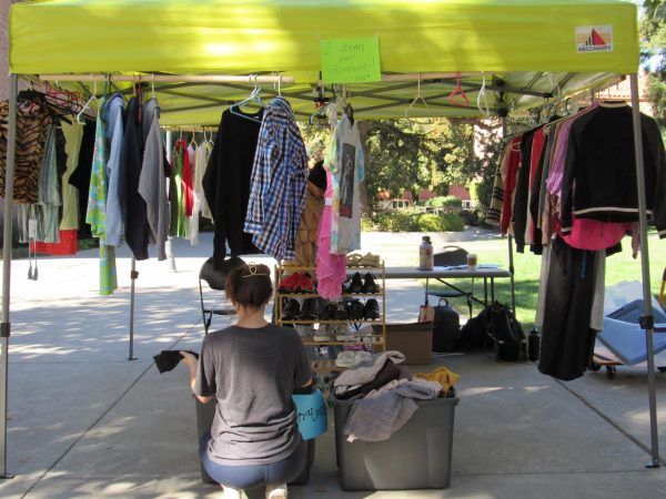 Students sifted through the donation buckets, exploring the shoe rack and swung through the hangers looking for the perfect clothing items at The CoolCat Closet on Trinity Lawn on Tuesday. Photo taken by Megan Gauer on Oct. 29. 
