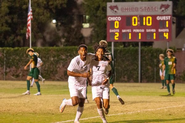 Elijah Beverley(left) and Sylas Sells(right) celebrate after Sells scored a goal on Oct. 25 taken by Jenna McMahon. Sells goal tied the game 1-1 before the first half was over. 