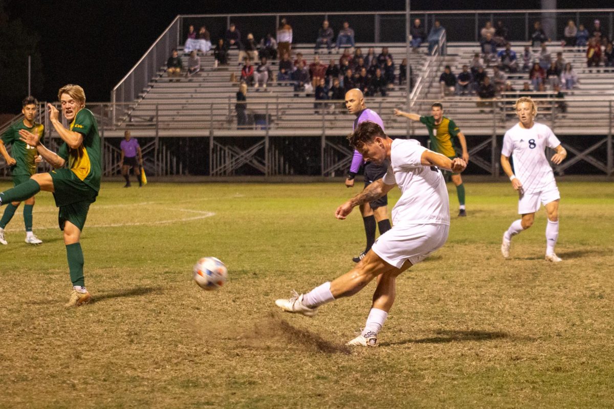 Defender Preston Moll takes a shot on goal on Oct. 25 taken by Jenna McMahon.  