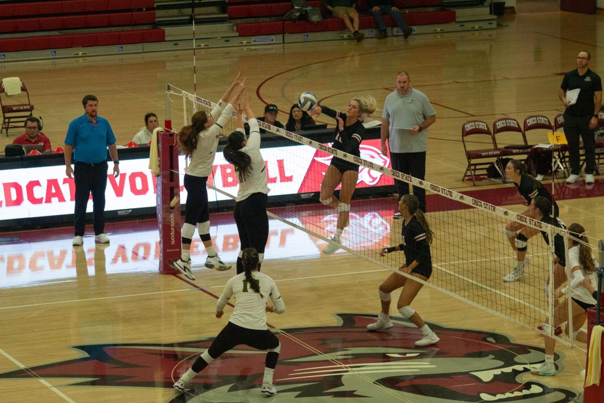 Cashe Olswang spikes the ball over the net against Cal Poly Pomona Oct. 26 taken by Jenna McMahon. 