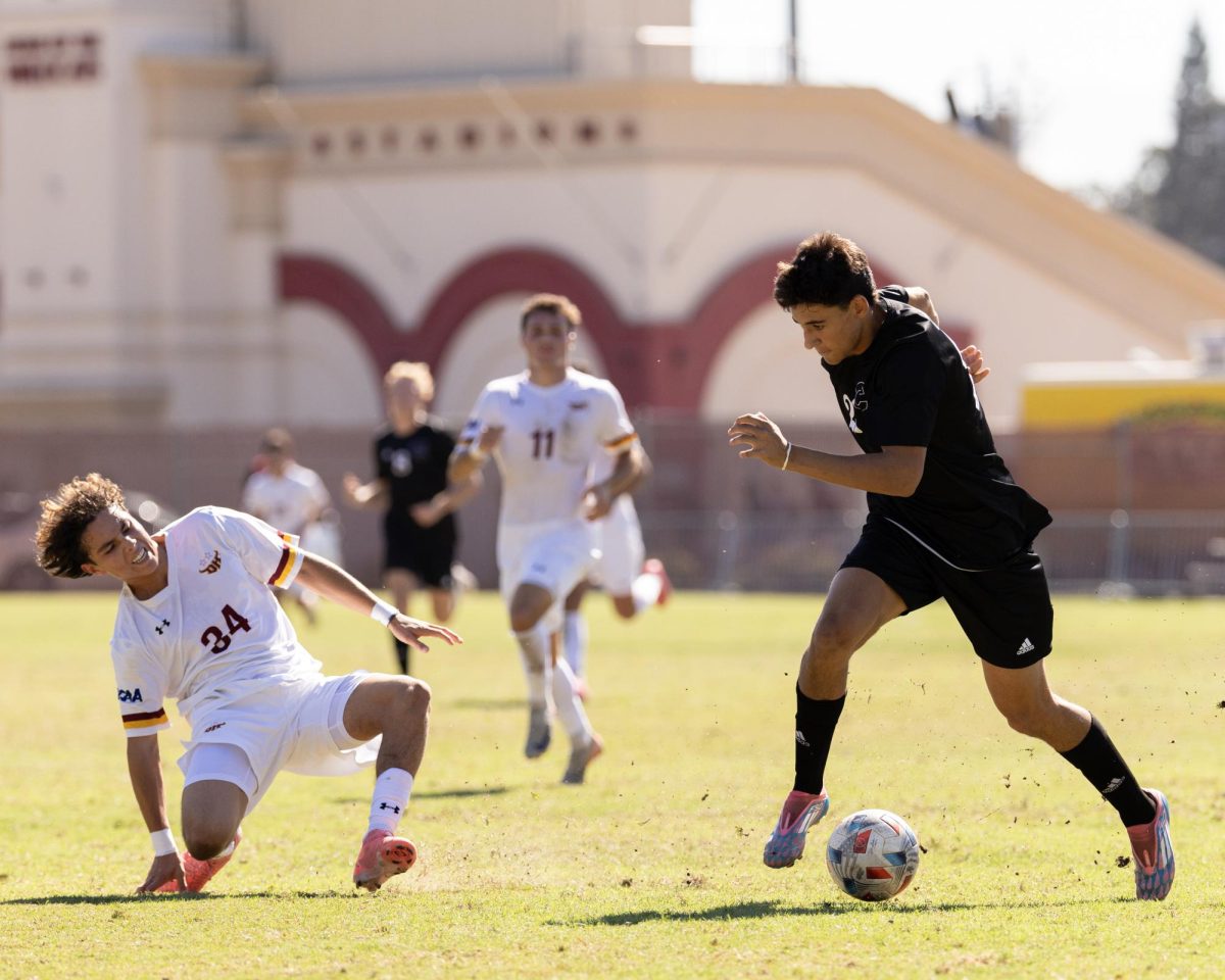 Darius Dukes dribbling down the wing, leaving his defender on the ground. Taken by Aaron Draper on Oct. 6.