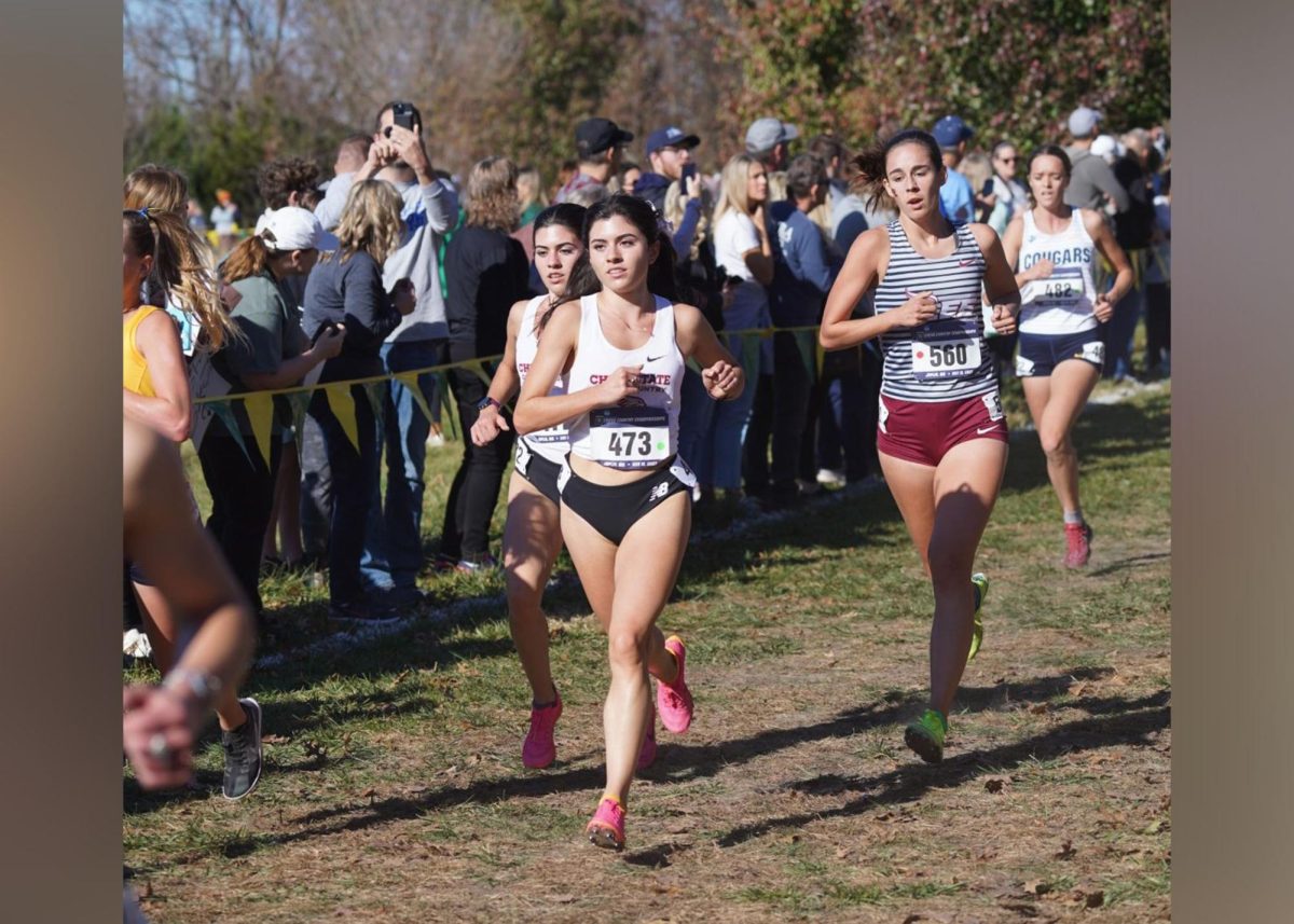 Iresh Molina, middle, finishing out the final push of a race next to her sister, Della, right. Taken by Joshua Beam.
