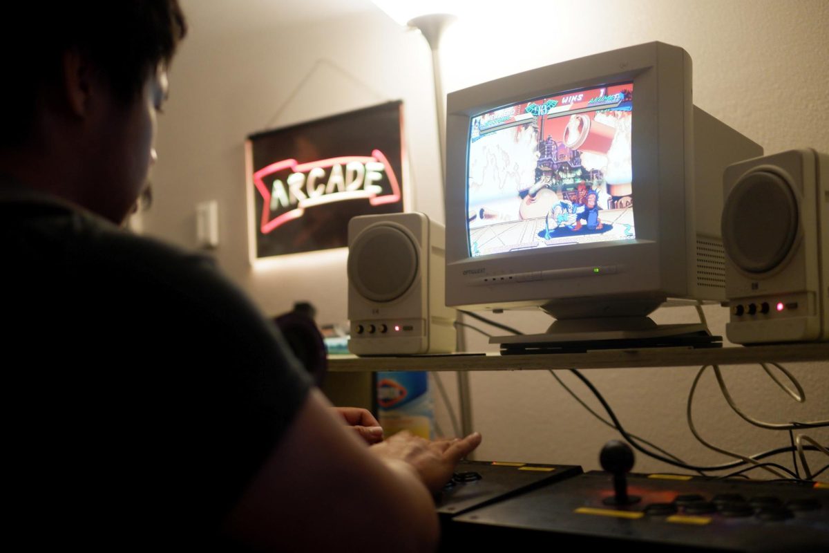 A student battles to the end of a close match. The arcade emulator setup had four joysticks and thousands of games to choose from.