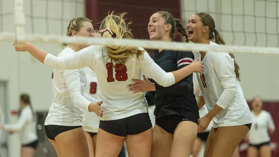 Kylie Matthews, Caitlyn Eichhorst, Jessie Camarillo and Kailie Flores celebrating a point against the Warriors. Taken Oct. 18 by Aaron Draper.