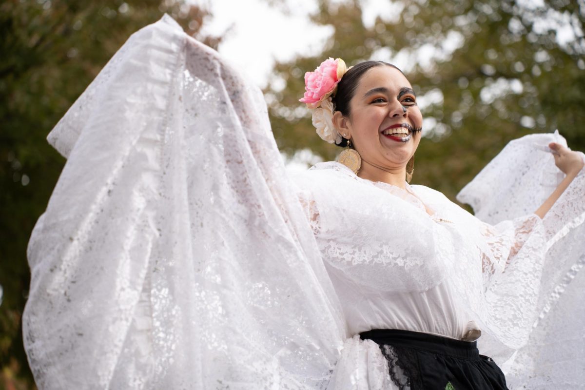 Cynthia Fletes, member of Ballet Folklorico de Chico, performs and wears Veracruz Traditional clothing. Fletes said dancing has taught her the importance of passion and honoring her culture at important events such as Day of the Dead.