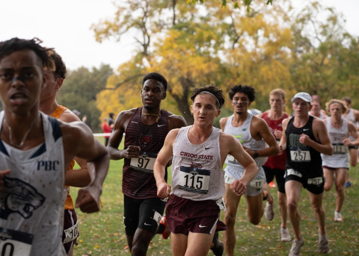 Senior Brayden McLaughlin powers trough the rain and muddy race course at the NCAA Division II Championship Saturday, Nov. 23, 2024 in Sacramento.