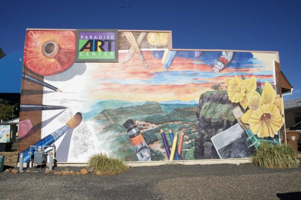 The mural on the side of Paradise Art Center depicts Paradise’s landscape before the Camp Fire. The empty space symbolizes the community’s efforts to work toward revitalization. Photo taken by Lexi Lynn on Nov. 5.
