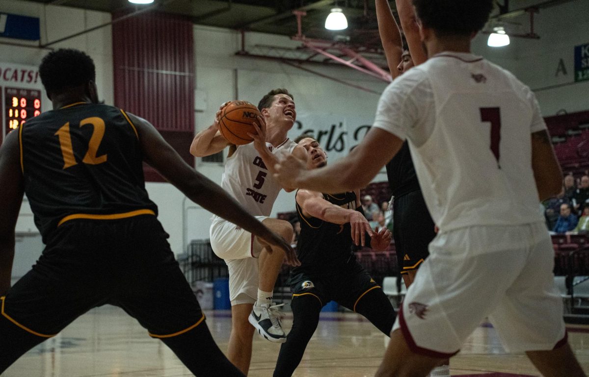 Junior guard Jojo Murphy jumps too shoot as Dominican University players try to defend Friday, Nov. 23, 2024, at Chico State.