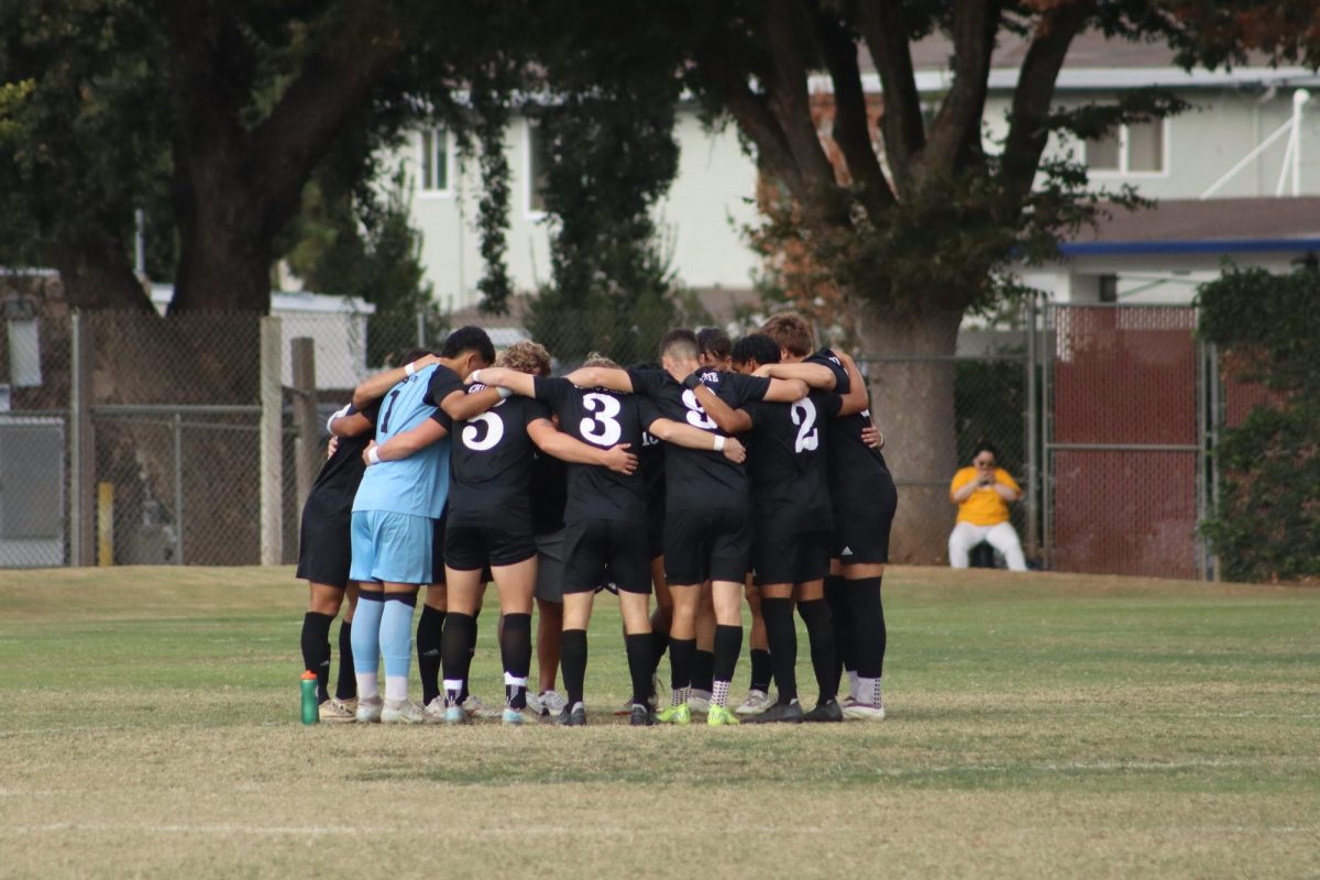 The Chico State Wildcats huddling up before their match against the Cal State San Bernardino Coyotes on their senior day, Oct. 27. The Wildcats would win this game 1-0. Photo taken by Trevor Lee.