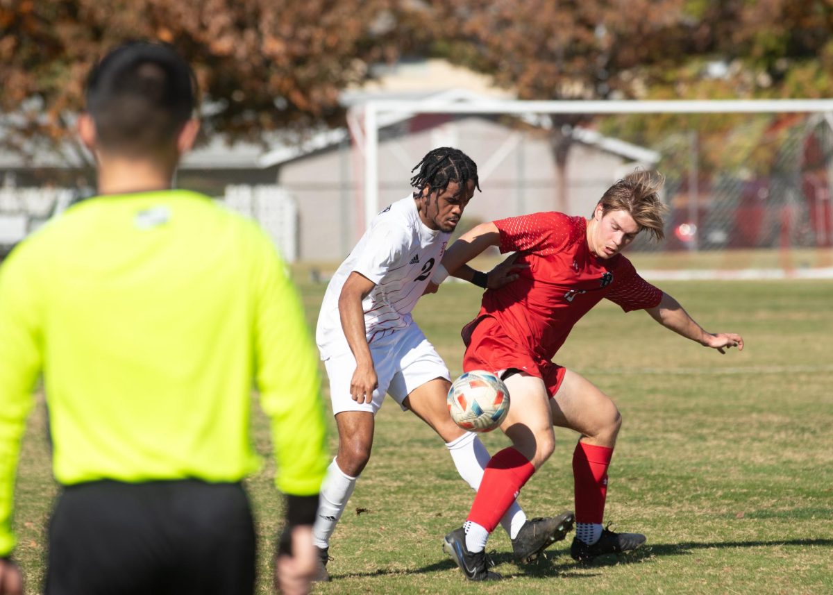 Junior defender Justin Ricketts battles against East Bay’s forward Bennett Richards for control of the ball during the first half of the game at Chico State Sunday, Nov. 10, 2024.