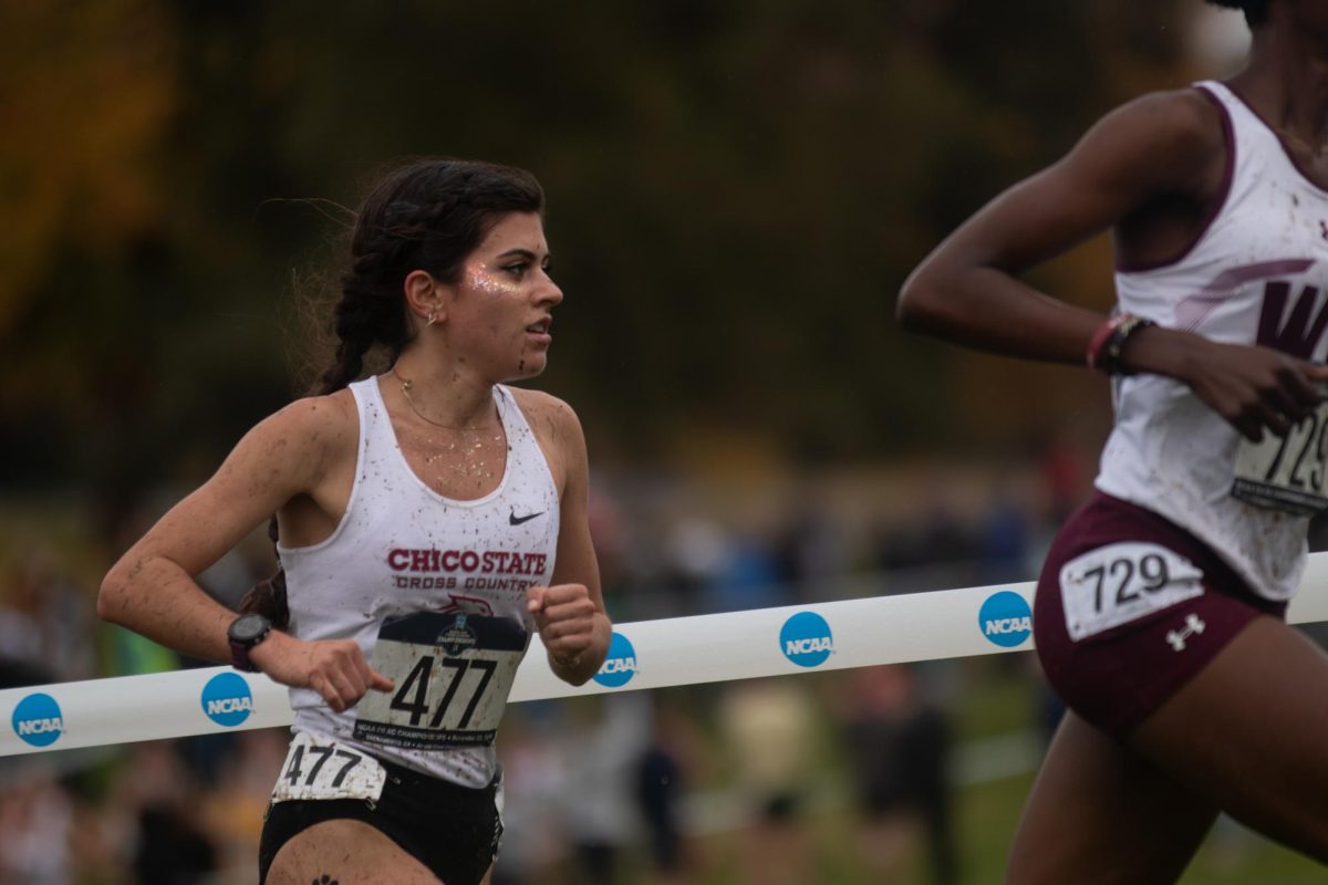 Junior Della Molina strides through the 6k race course. Molina finishes with a 32nd place and secures her second All-American title Saturday, Nov. 24, 2024 in Sacramento.