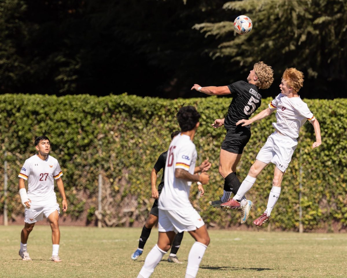 Chico State Wildcat Miles Rice (#5)  jumping in the air in an attempt to win a header in a 2-2 draw, against the Cal State Dominguez Hills Toros on Oct. 6. Photo taken by Aaron Draper. 