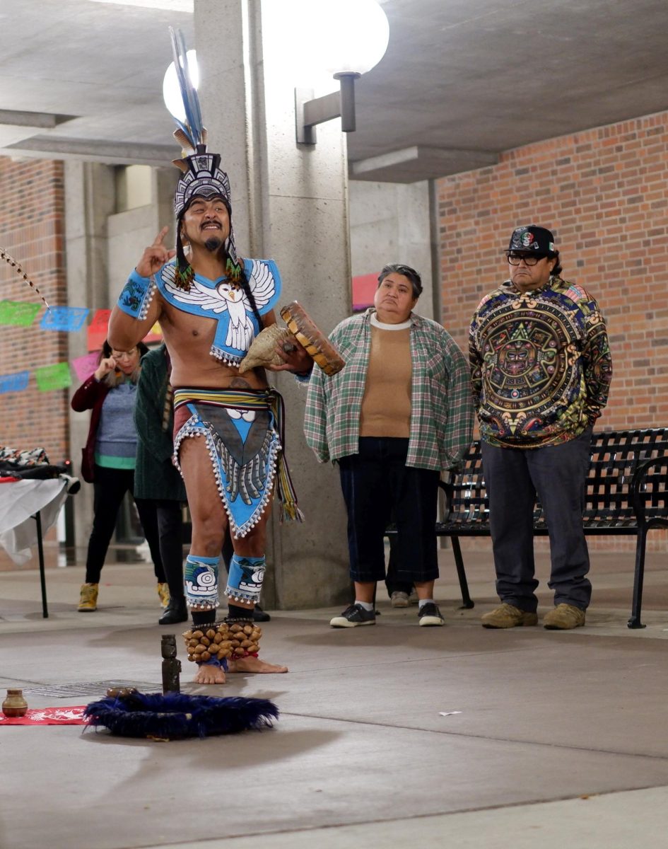 Jesus Tecolotecpatl changed into traditional Aztec garments to perform ritual dances. The origins of Dia de Muertos are traced back to ancient Mesoamerican cultures like the Aztecs and Mayans. 