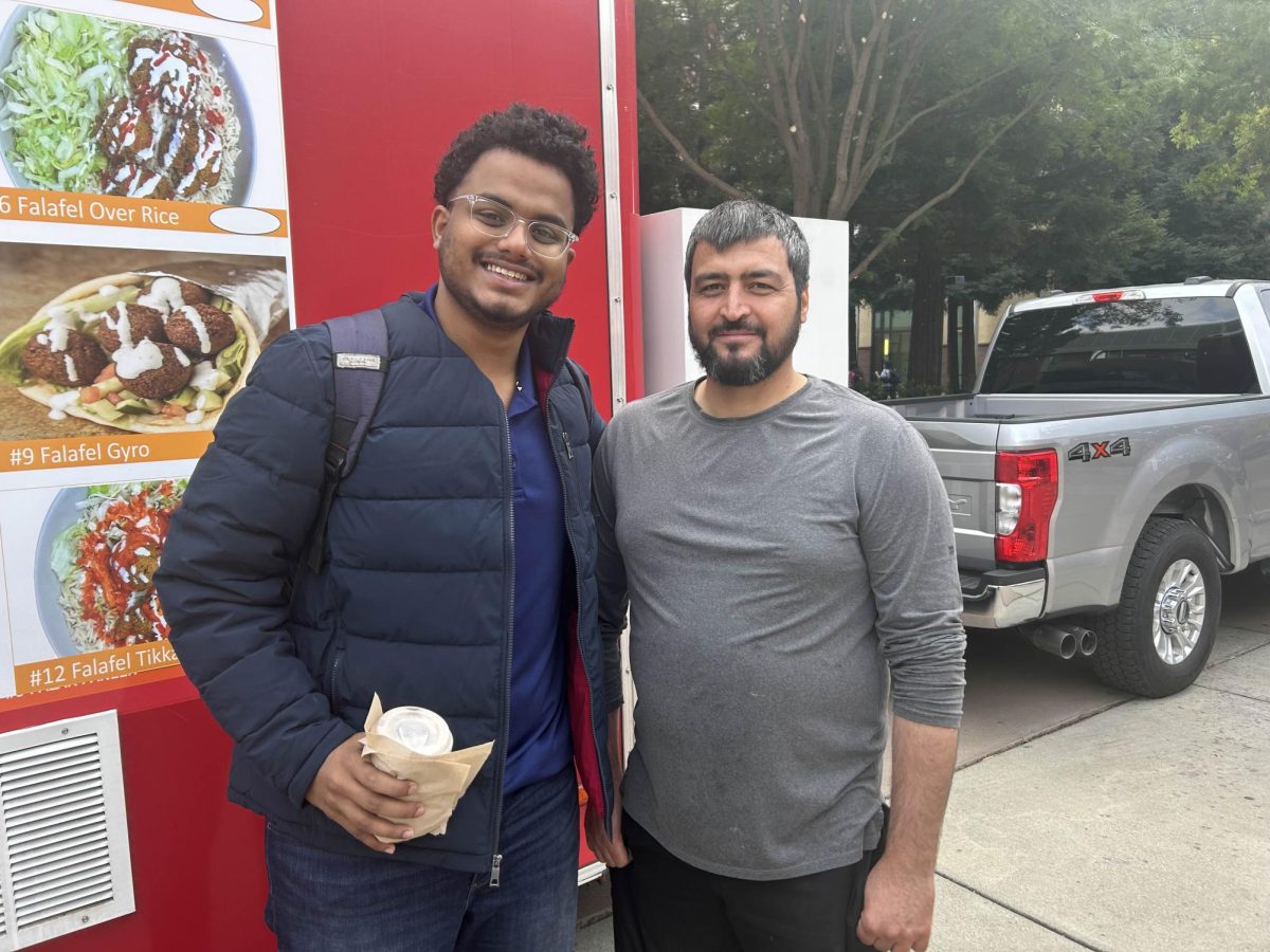 Student Pavan Kasukurti (left) and owner Ahmad Ghous (right) outside the truck. Taken by Dominic Curcuro on Oct. 27th, 2024. 
