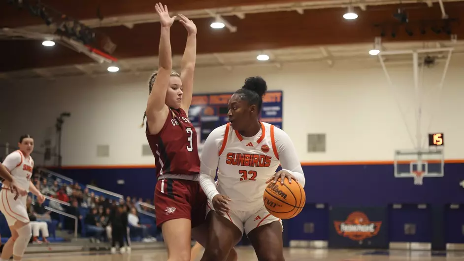 Jordan Allred playing tight defense against the Sunbirds. Photo taken Nov. 9 by Megan Leblanc.